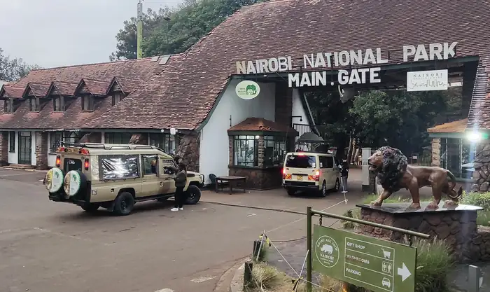Entrance gate of a national park with safari vehicles